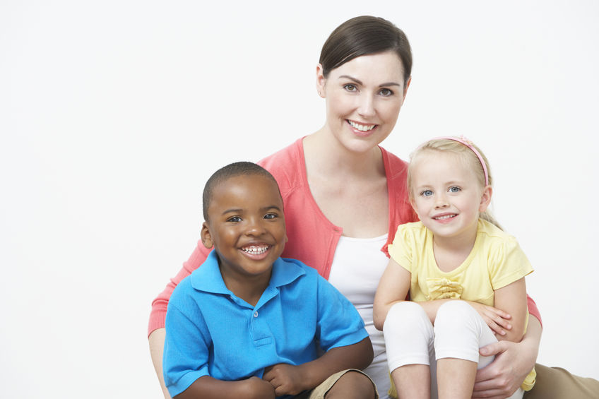 30937239 – studio portrait of female pre school teacher with pupils